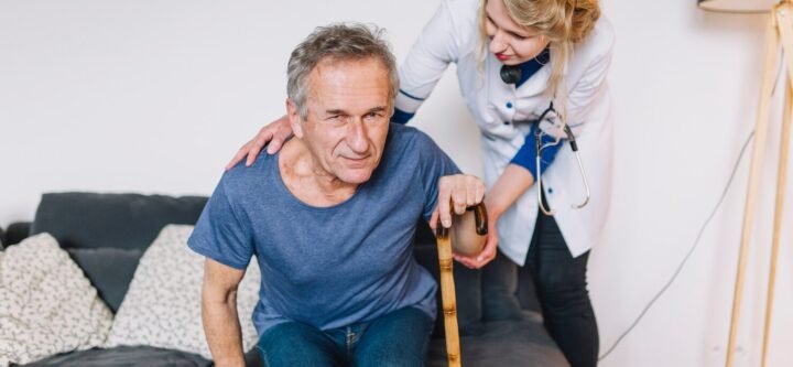 man-with-stick-retirement-home_23-2147788038